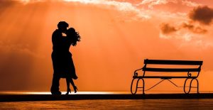 Kissing, loving, sunset